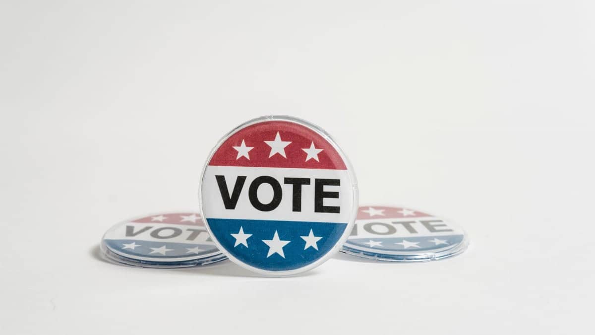 Close-up of a vote button symbolizing election participation and democracy.