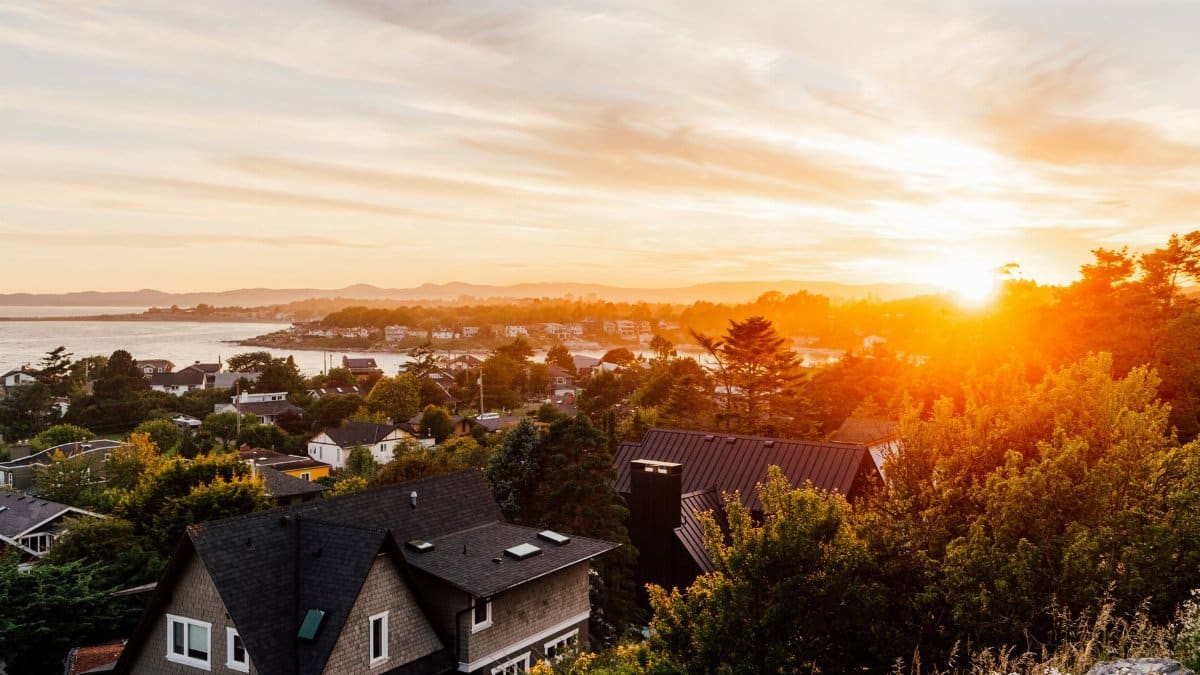 Breathtaking sunset view over a residential area in Victoria, BC, Canada with vibrant colors.