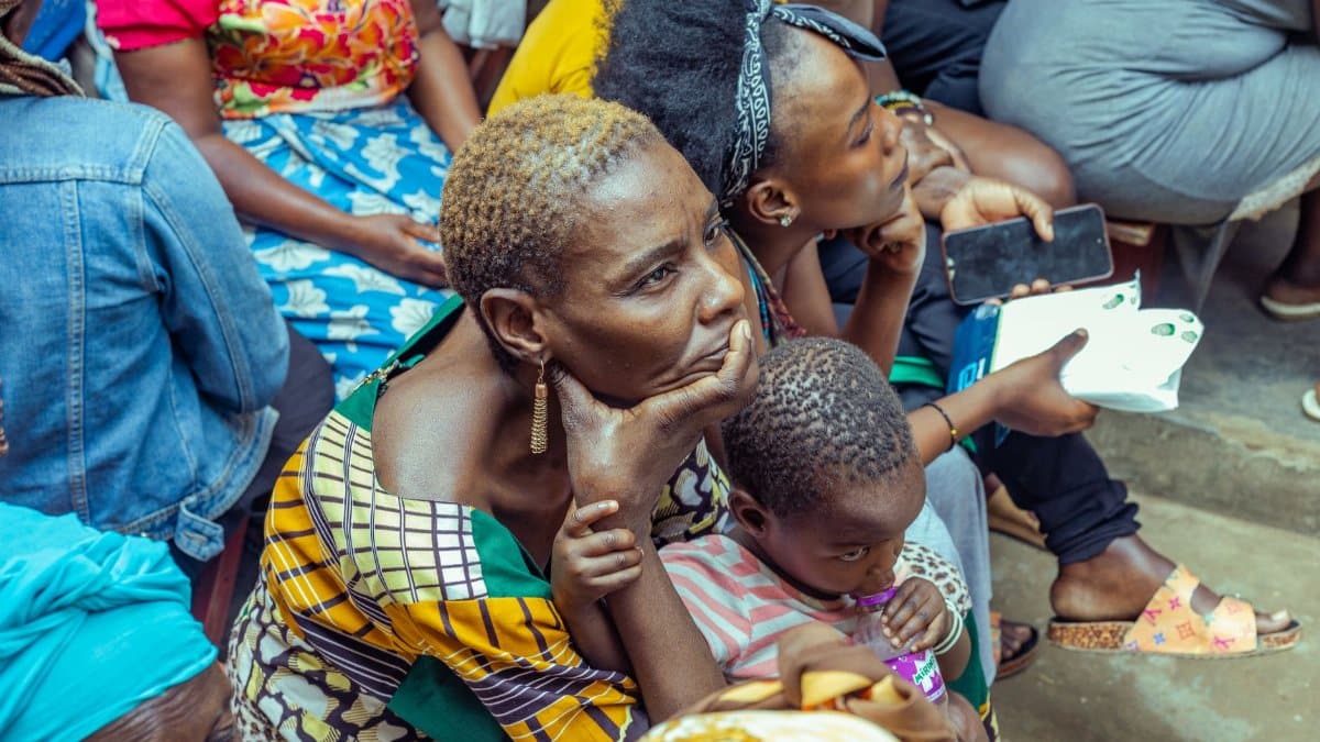 A diverse group of people attending a community event in Kampala, Central Region, Uganda.