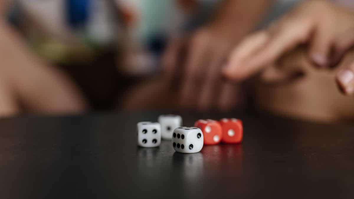Close-up view of colorful dice on a table, capturing the essence of luck and chance.