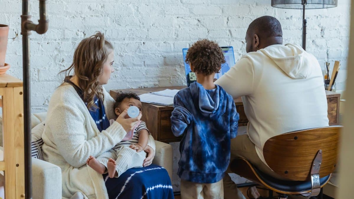 A diverse family enjoying quality time together, focusing on bonding and shared moments indoors.