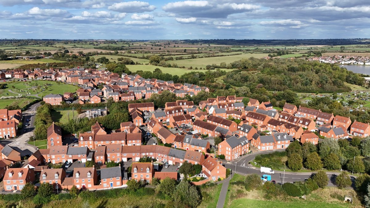 A stunning aerial view of residential housing in Aylesbury, England surrounded by lush landscapes.