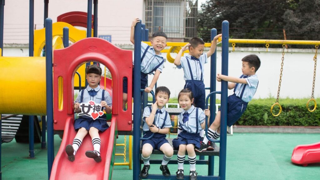 Group of children playing happily at a vibrant playground. Outdoor fun and joy.