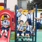 Group of children playing happily at a vibrant playground. Outdoor fun and joy.