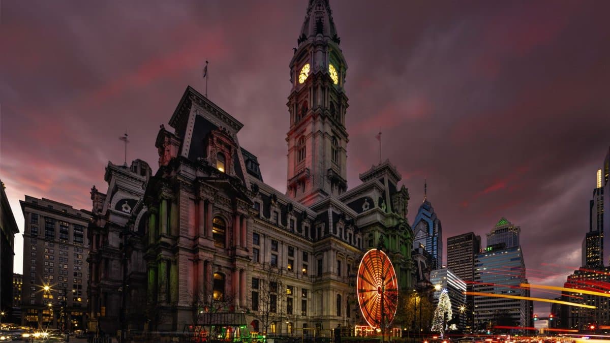 Philadelphia City Hall lit up during the Christmas season with festive lights.