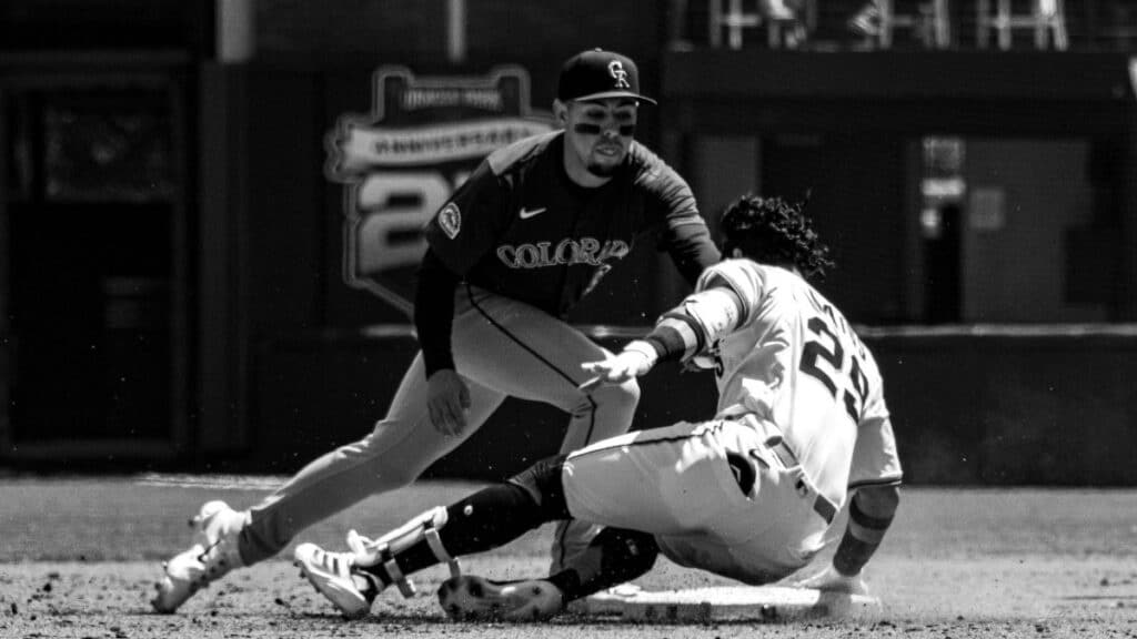 Dynamic black and white photo capturing baseball action in San Francisco.