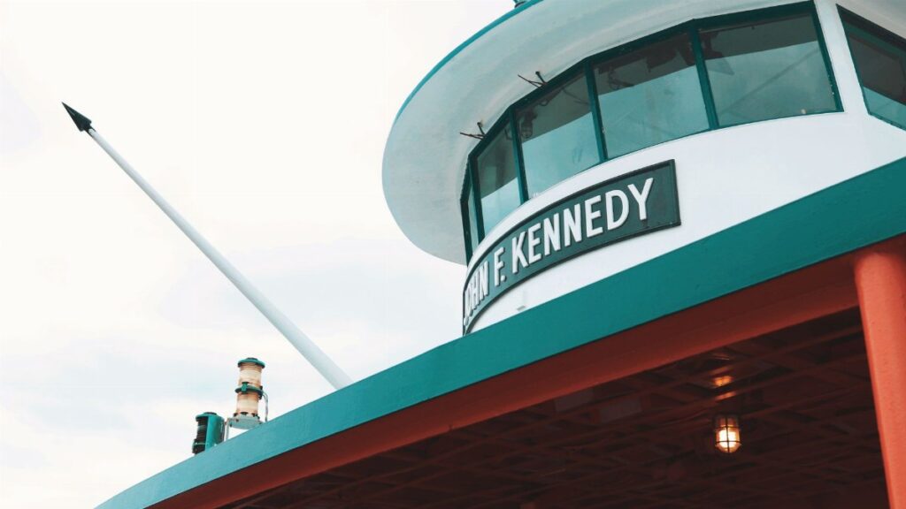 Low angle view of John F. Kennedy ferry exterior on a cloudy day, New York City.