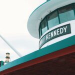 Low angle view of John F. Kennedy ferry exterior on a cloudy day, New York City.