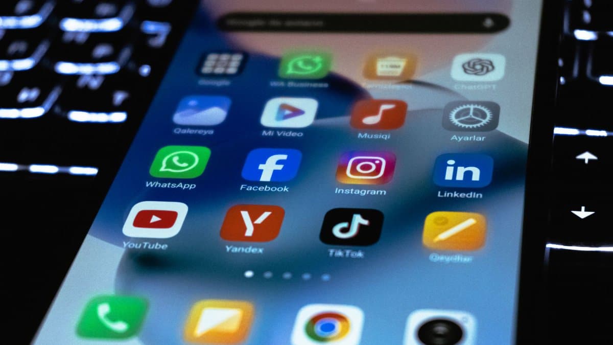Close-up of a smartphone screen showing popular social media and utility app icons.