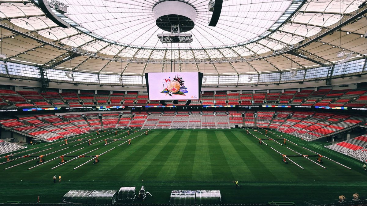 Interior view of BC Place Stadium in Vancouver, showcasing its vast seating and advanced roof structure.