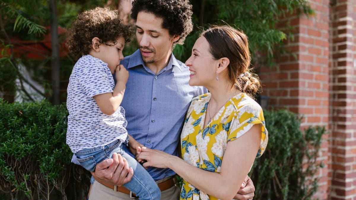 Family enjoying a sunny day outdoors, emphasizing love and togetherness.