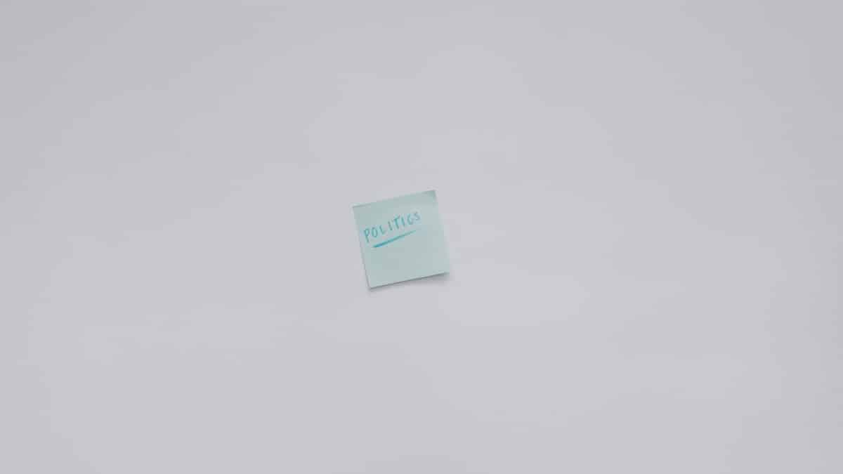 Simple top view of a note with the word 'Politics' on a white background.