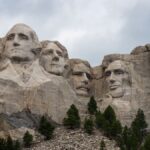 A striking view of Mount Rushmore featuring the carved faces of U.S. Presidents in the Black Hills of South Dakota.