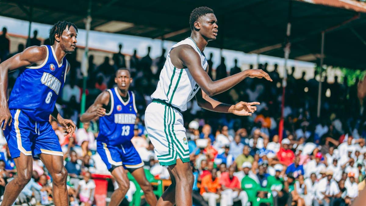 Action-packed outdoor basketball game with players in motion and an engaged audience.