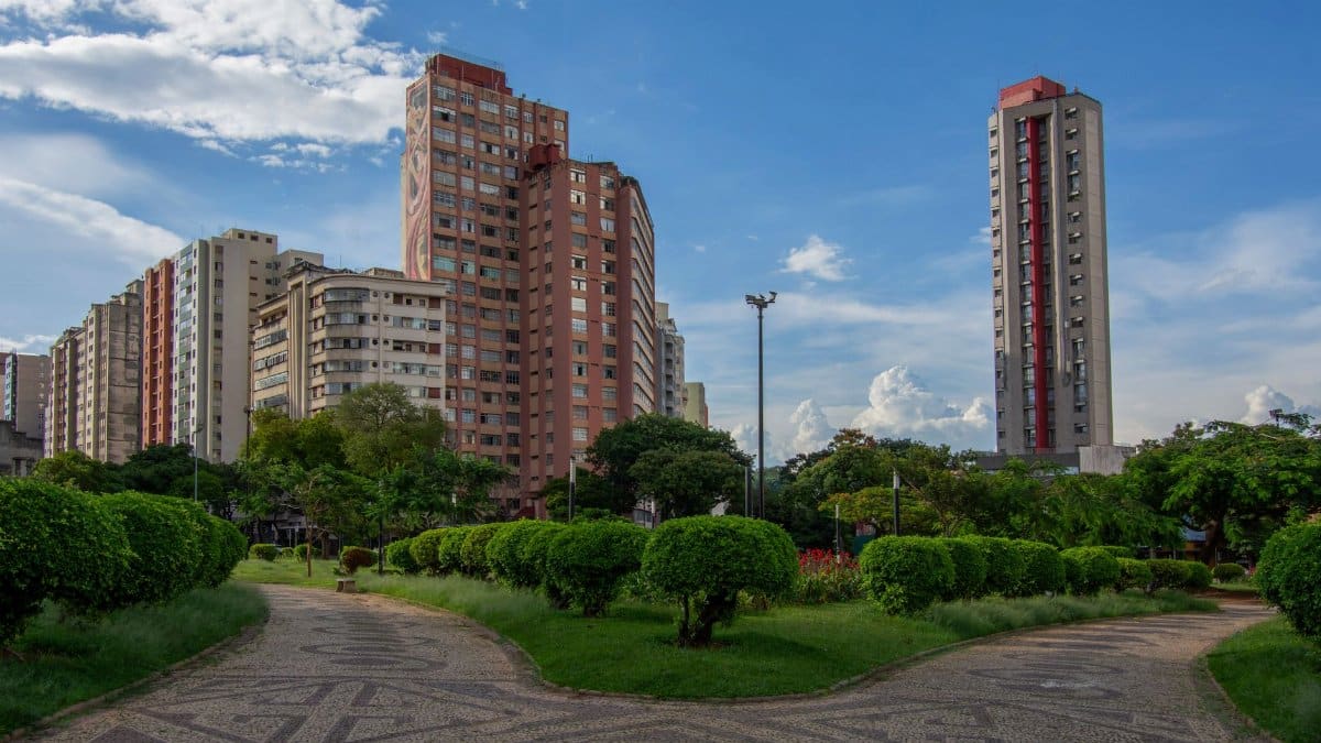 Urban landscape of Belo Horizonte with modern high-rises and manicured gardens.
