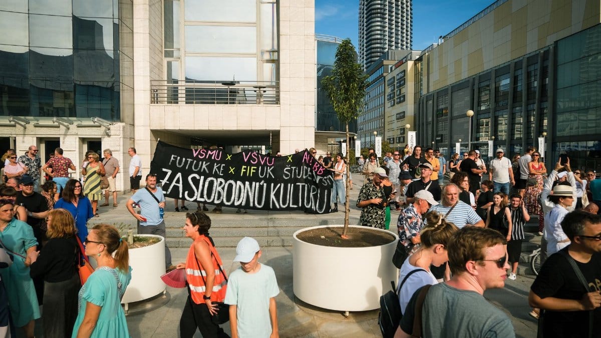 A peaceful protest in Bratislava advocating for cultural freedom with diverse participants.