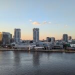 Stunning view of Tampa Bay skyline at dusk, reflecting on the calm waters.