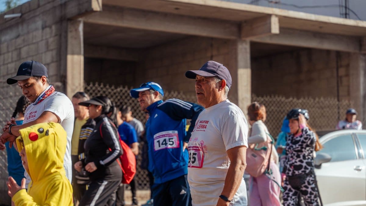 Participants engage in a vibrant marathon event, showcasing diverse attire and lively atmosphere.