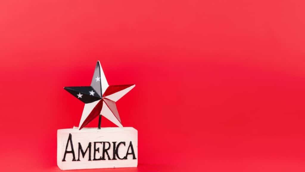 Decorative star and America text on red backdrop, perfect for patriotic themes.