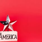 Decorative star and America text on red backdrop, perfect for patriotic themes.