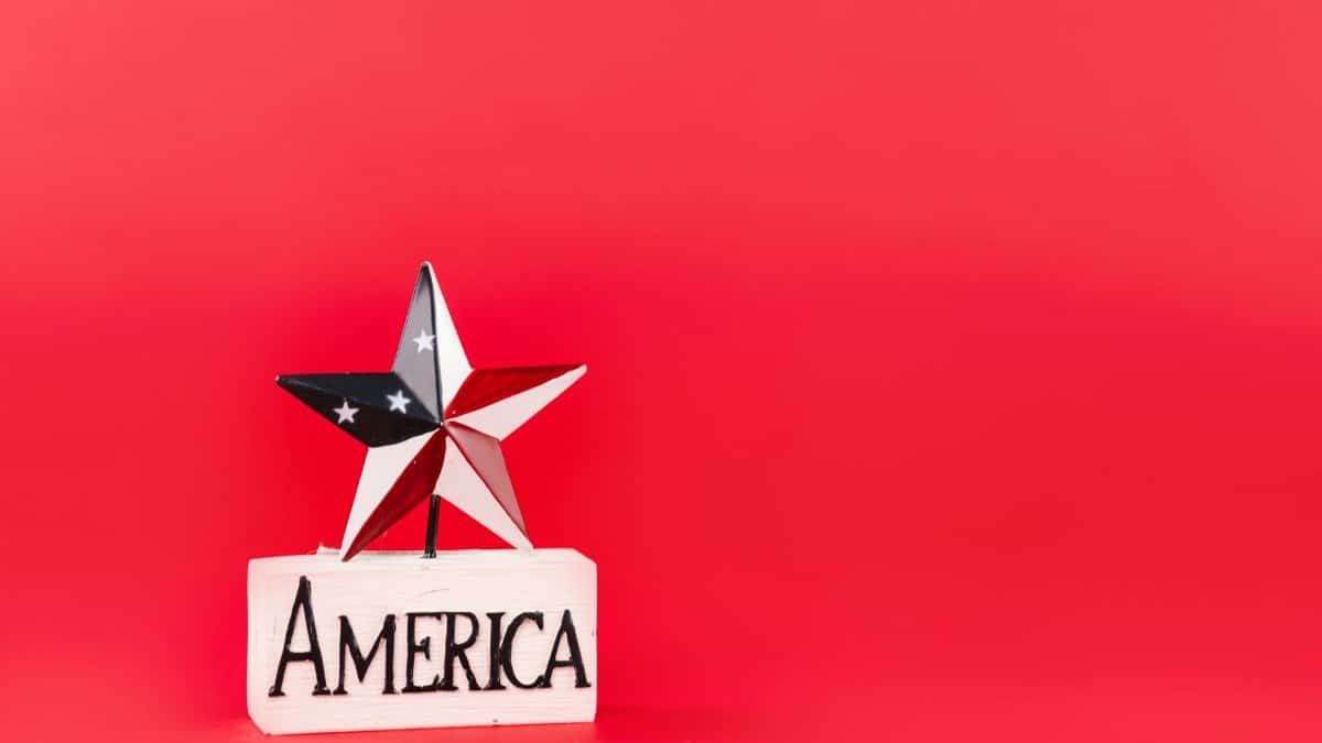 Decorative star and America text on red backdrop, perfect for patriotic themes.