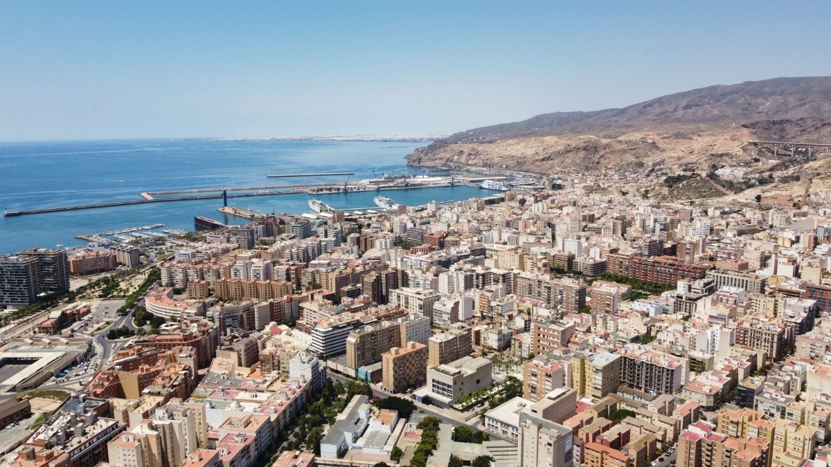 Explore the stunning aerial view of Almería, Spain, showcasing its vibrant cityscape and harbor.