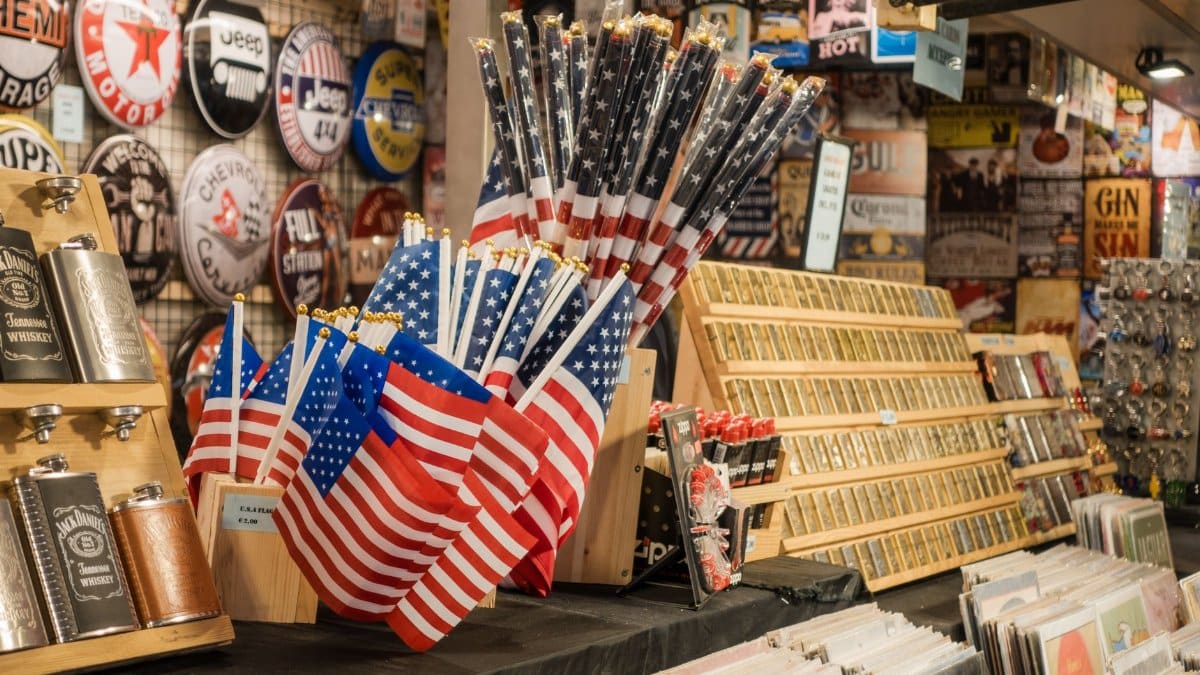 Shop interior with patriotic American flags and souvenirs displayed.