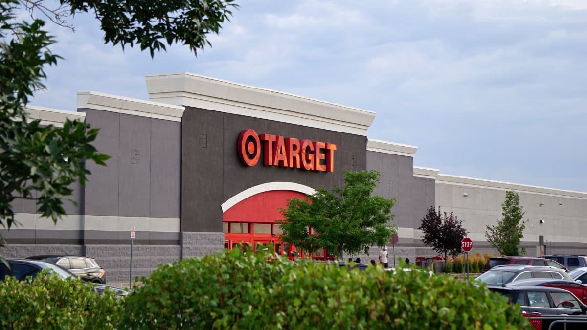 View of a Target store with parking lot, featuring signage and greenery.