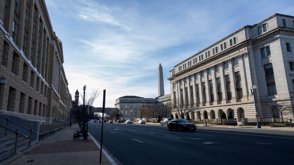 Street view in Washington DC featuring historic buildings and the Washington Monument.