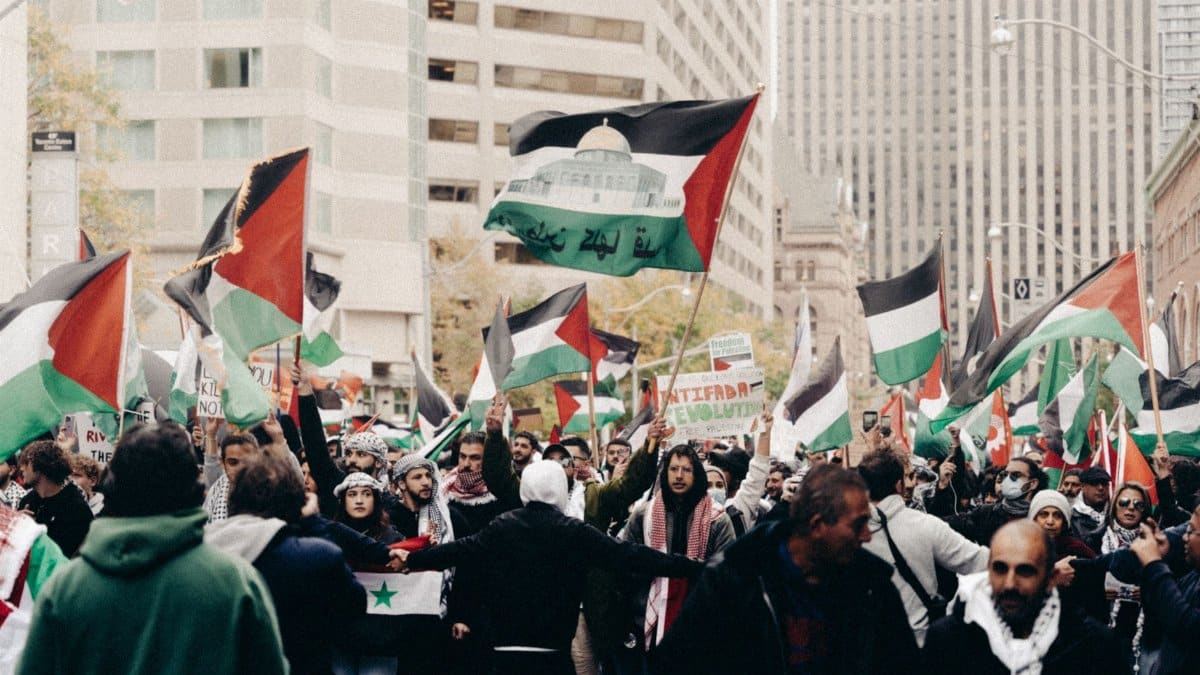 A vibrant street protest with flags and signs, highlighting passion and activism.