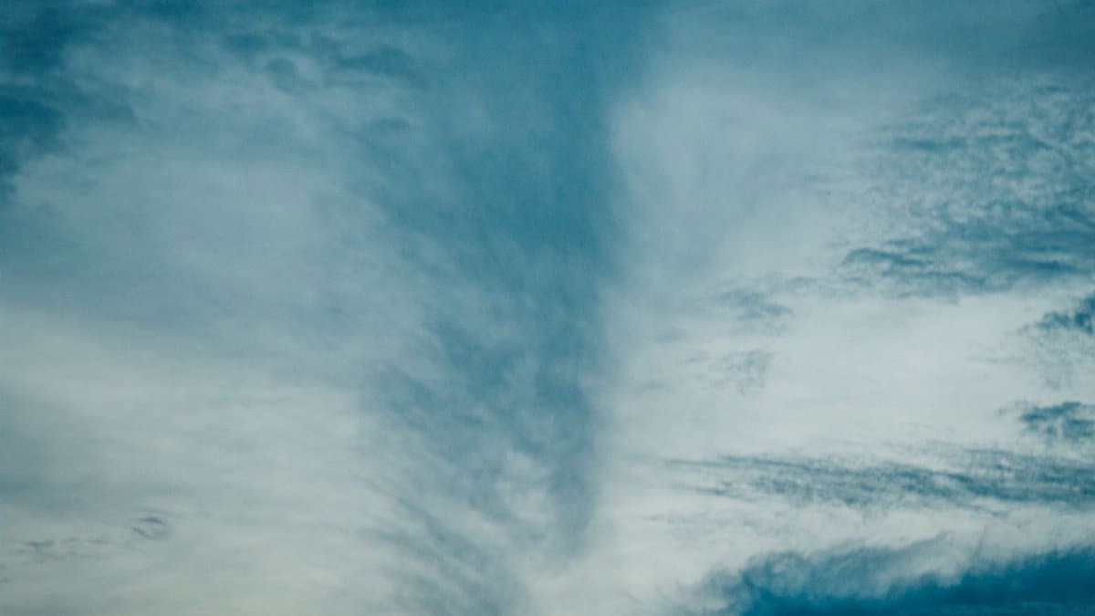 Spectacular scenery of fluffy clouds floating in atmosphere on gloomy sky high in air on evening time in nature at sunset