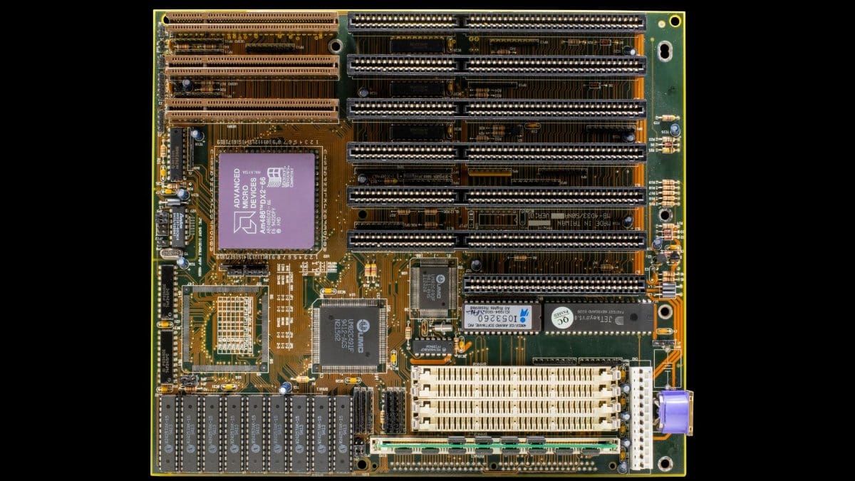 High-resolution photo of a vintage computer motherboard showcasing intricate electronic components and circuitry.