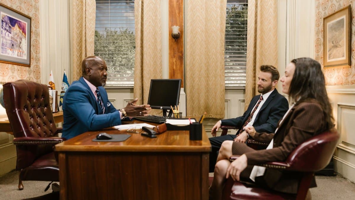 Lawyers discussing with a client in a professional office environment. Business meeting concept.