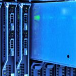 Detailed view of server racks with glowing lights in a data center environment.