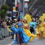 Colorful carnival dancers parade through the lively streets of San Francisco, California.