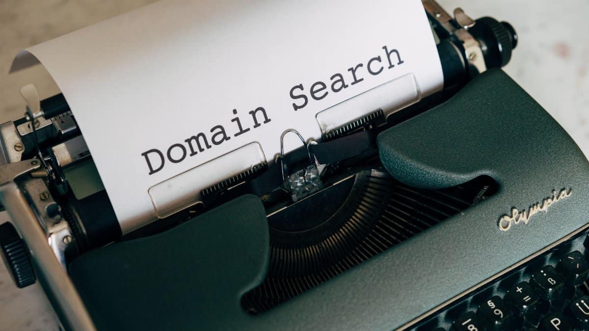 Close-up of a vintage typewriter with paper displaying 'Domain Search' text for conceptual design.