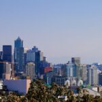 Iconic Seattle skyline featuring the Space Needle against a clear blue sky.