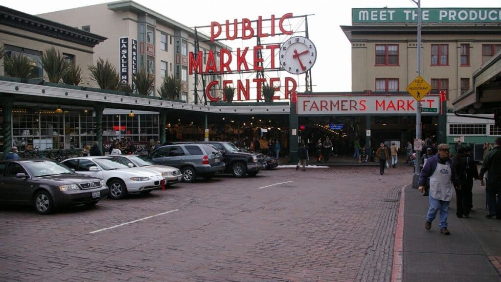 Historic Pike Place Market in Seattle with bustling activity and iconic signage.