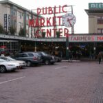 Historic Pike Place Market in Seattle with bustling activity and iconic signage.