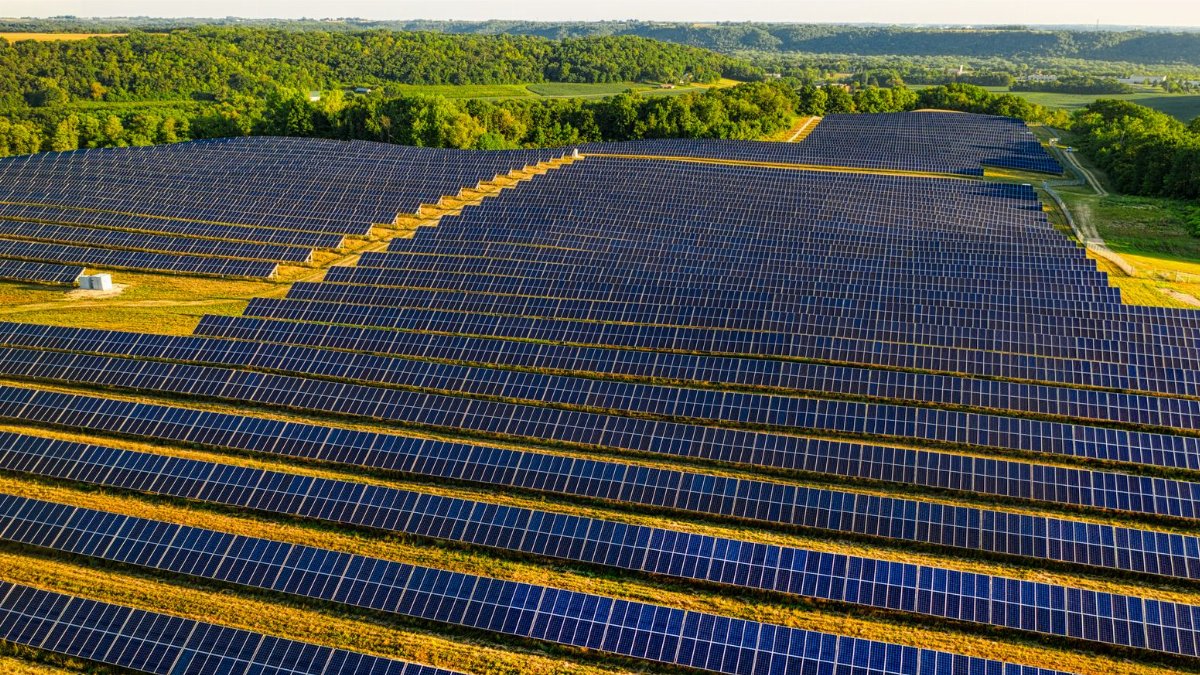 Aerial view of a vast solar farm in Red Wing, MN, generating renewable energy.