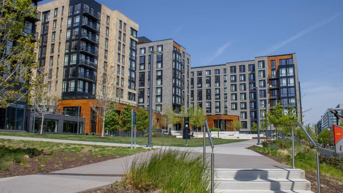 A modern apartment complex with scenic landscaping in Washington DC's urban area.