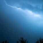 Captivating image of a lightning strike cutting through a dark, stormy sky.