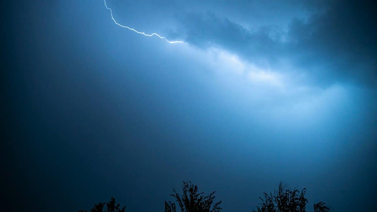Captivating image of a lightning strike cutting through a dark, stormy sky.