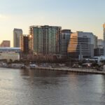 A stunning view of Tampa's skyline reflecting on the water at sunset.