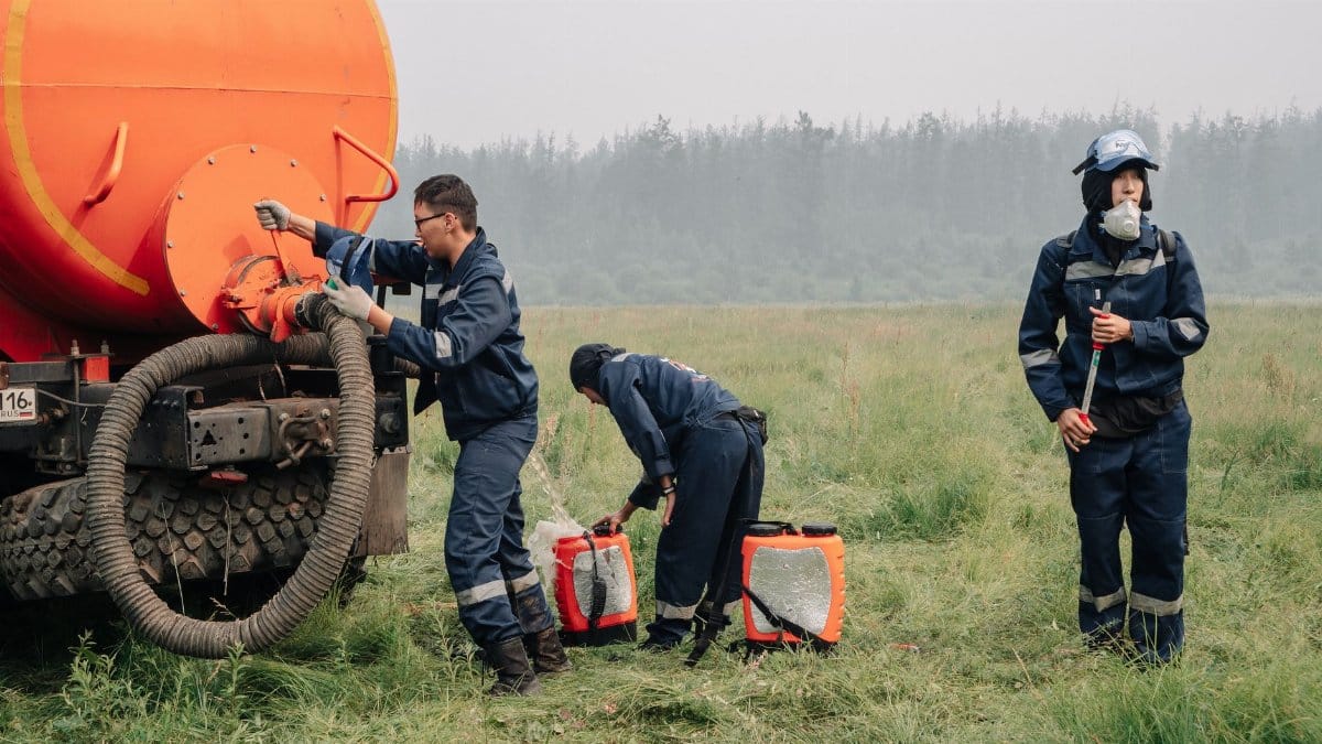 Firefighters gear up to battle field fires in Yakutia, Russia.