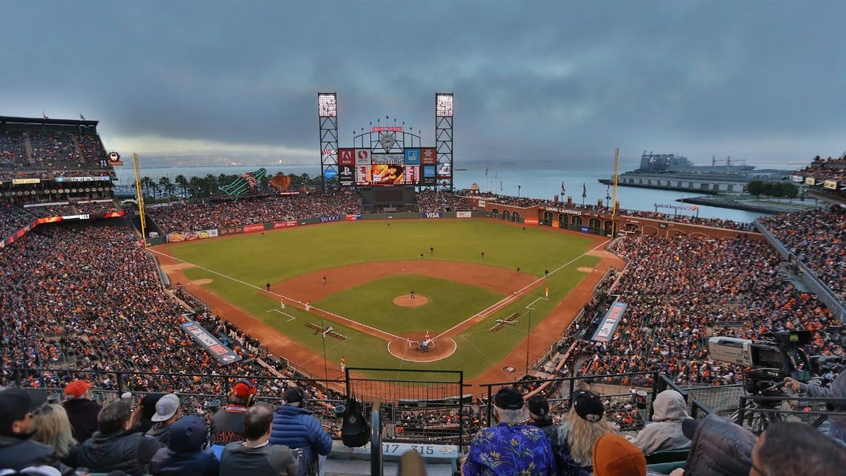 Exciting baseball game at Oracle Park, capturing vibrant crowd and iconic San Francisco skyline.