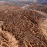 Stunning aerial photograph showcasing the rugged terrain of a canyon landscape, emphasizing natural beauty.