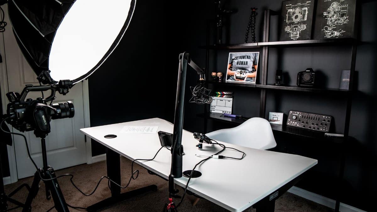 A stylish indoor vlogging studio equipped with professional lighting and camera setup.