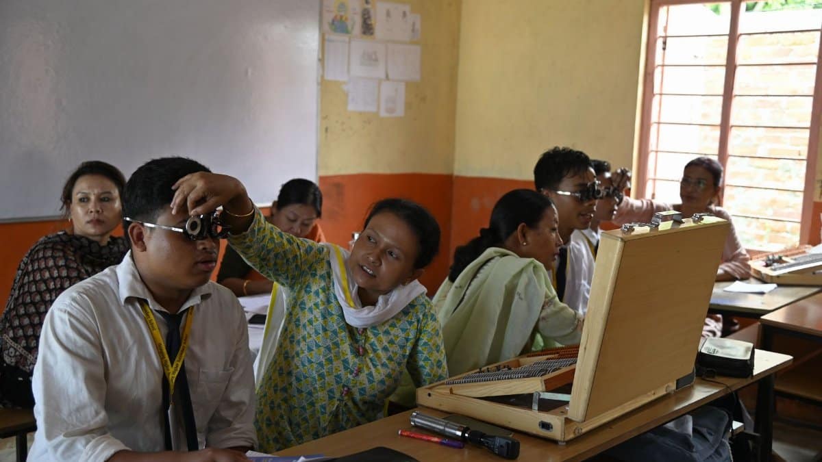 Educational vision screening session for children in an Indian classroom, promoting eye care.