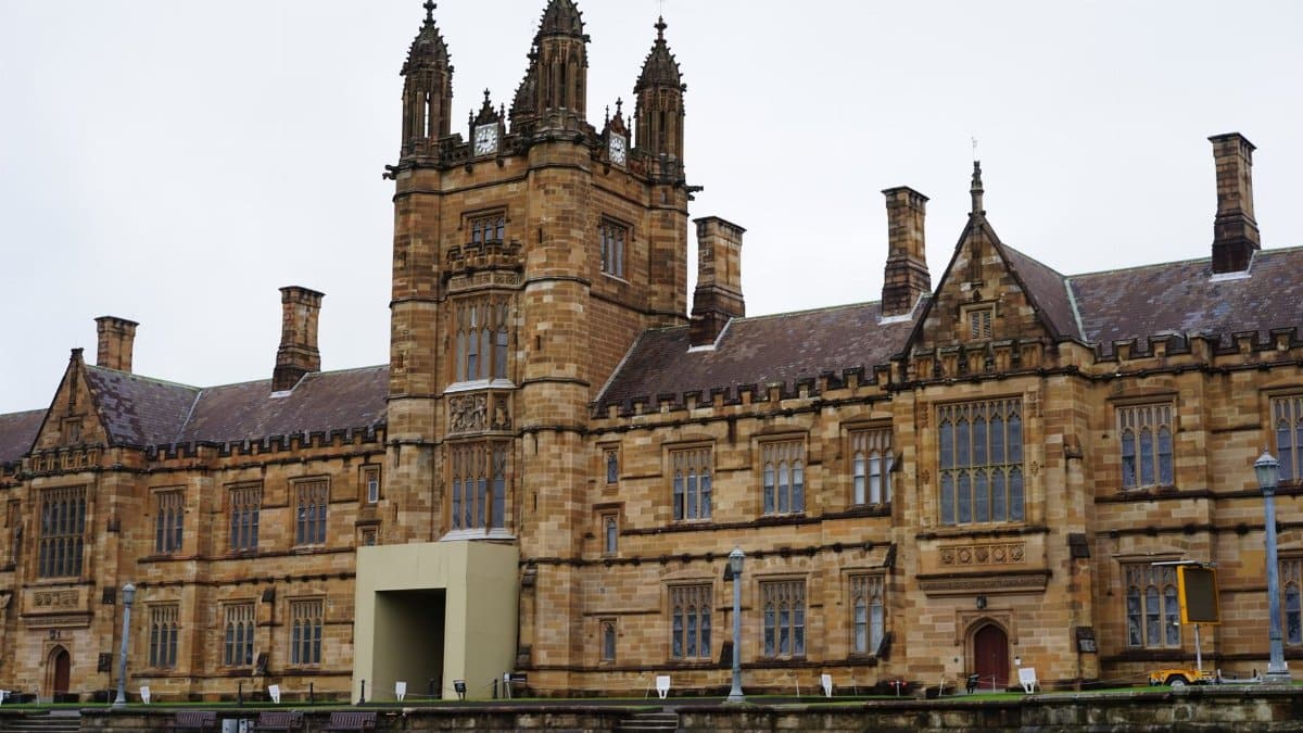 Front view of a historic university building with gothic architecture.